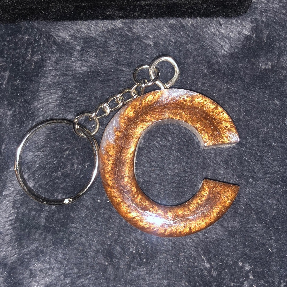 C Bronze and silver resin keychain